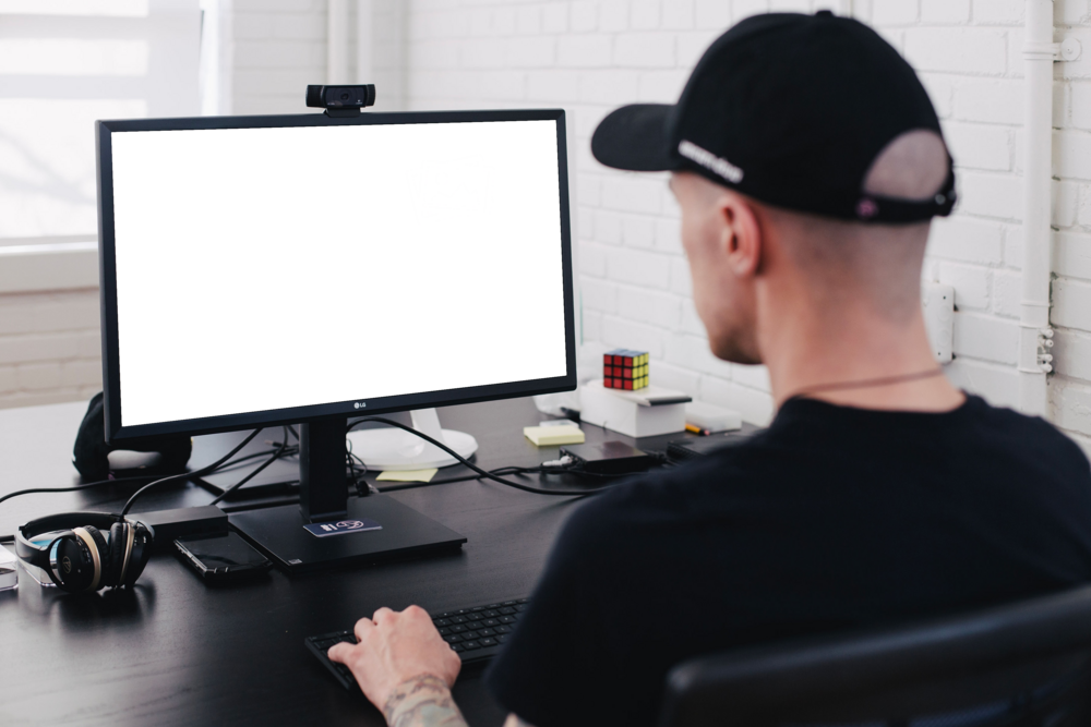 Desktop Mockup: person working in the office on lg pc