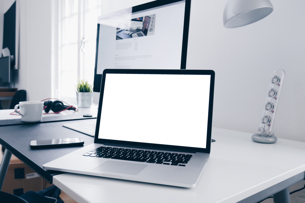 Laptop Mockup: macbook on the table in the house