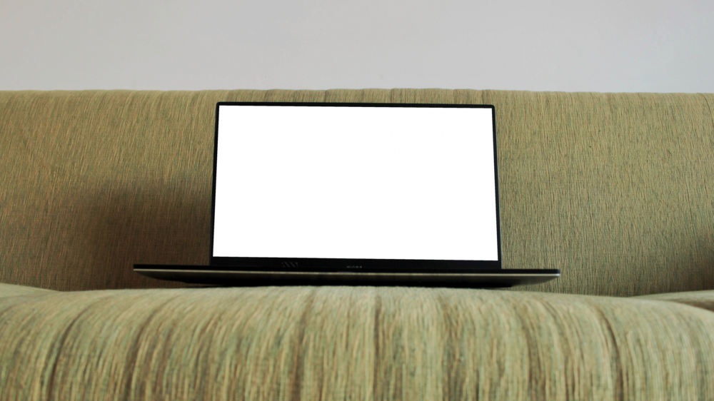 Laptop Mockup: laptop on a cauch