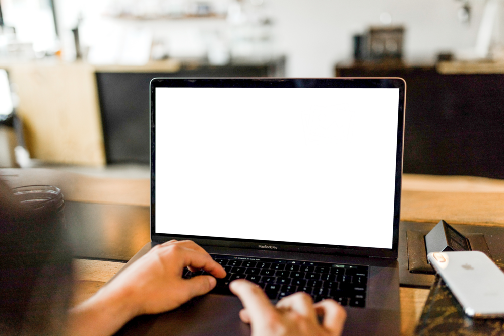 Laptop Mockup: person using laptop keyboard