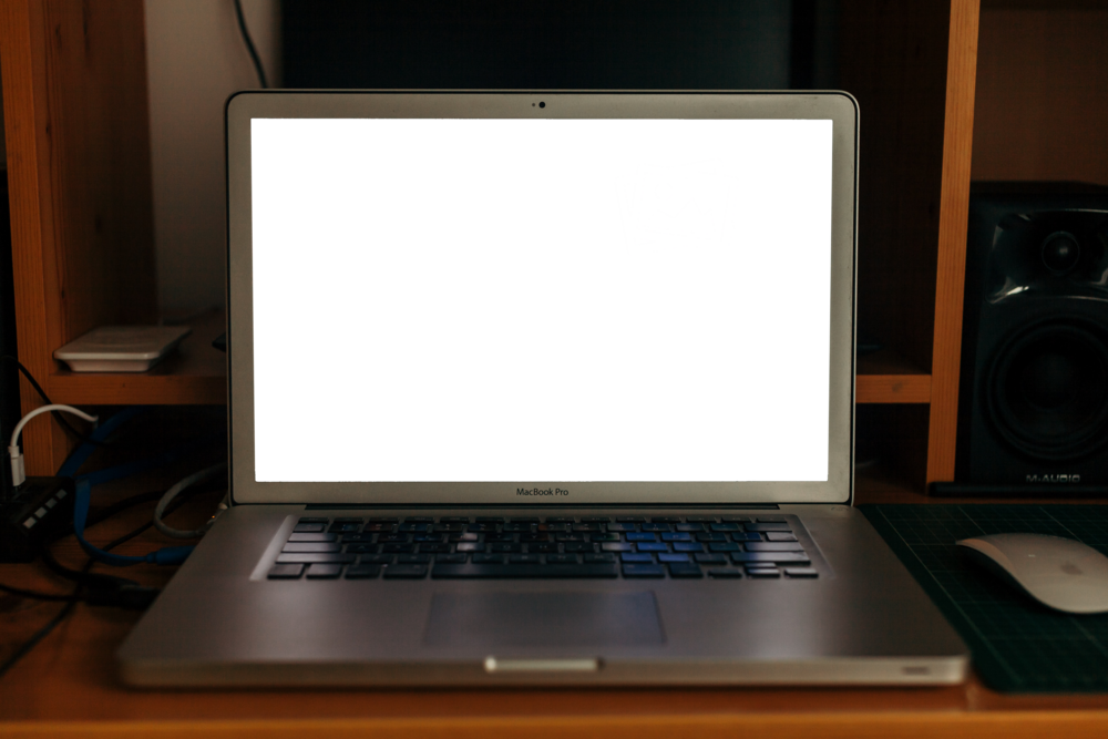 Laptop Mockup: laptop placed in very dar home corner