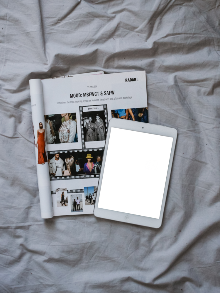 Tablet Mockup: tablet on the bed on top of magazine
