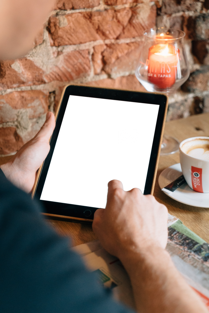 Tablet Mockup: person using ipad in the coffee shop